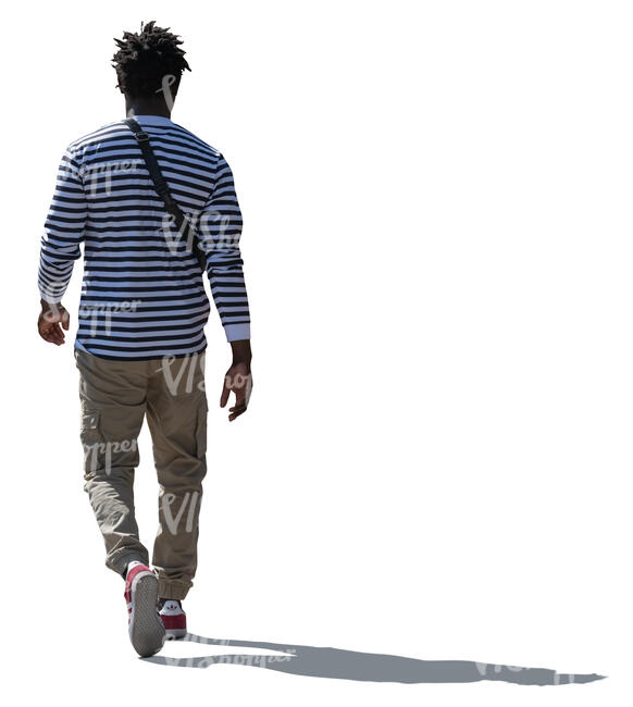cut out backlit black man in a striped shirt walking