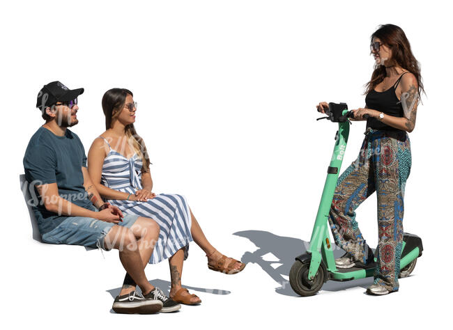 woman with a scooter standing and talking to two people sitting