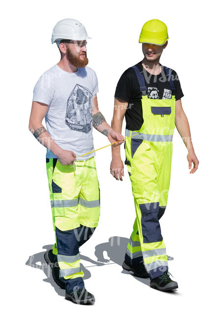 two cut out construction workers walking