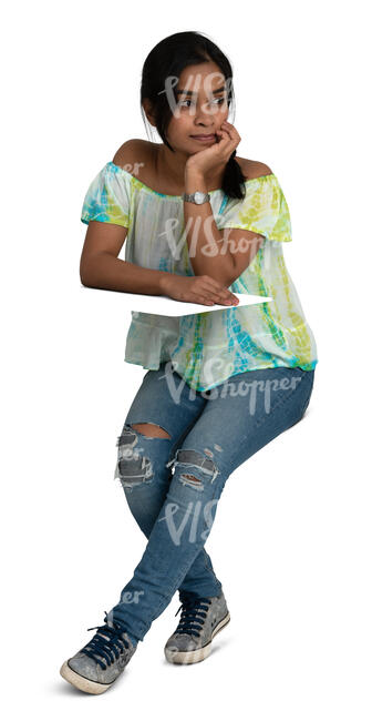 indian woman sitting and leaning elbows on a table