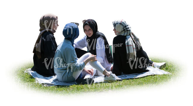 cut out group of muslim girls having a picnic on the grass