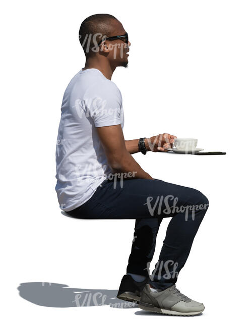 black man sitting in a cafe in summer