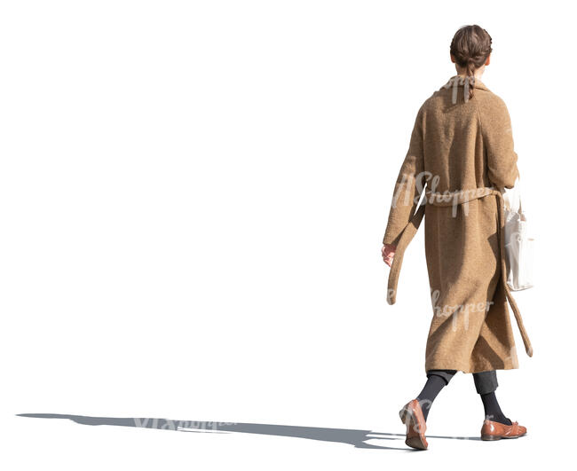 woman in a brown overcoat walking