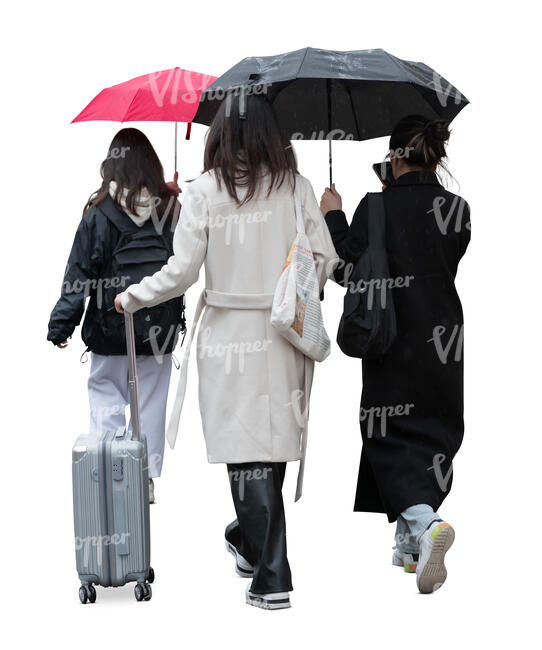 group of women with suitcases and umbrellas walking