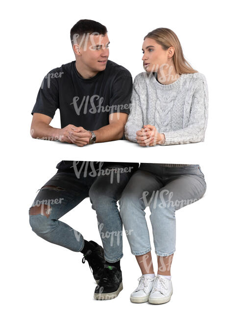 man and woman sitting behind a desk