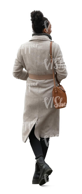 woman wearing an overcoat walking