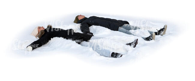 two cut out people lying in the snow making snow angels