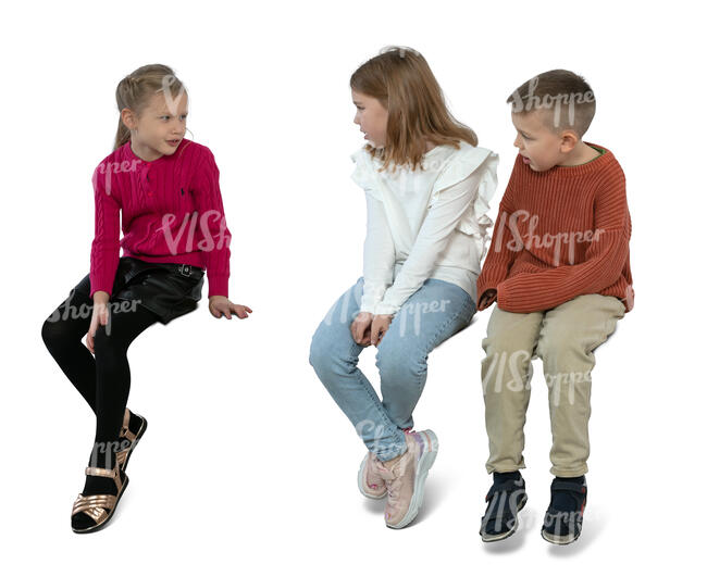 three children sitting and talking