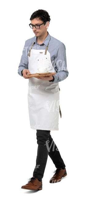 young male waiter with a white apron walking