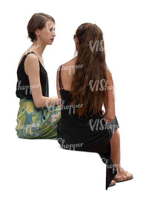 two women sitting and talking