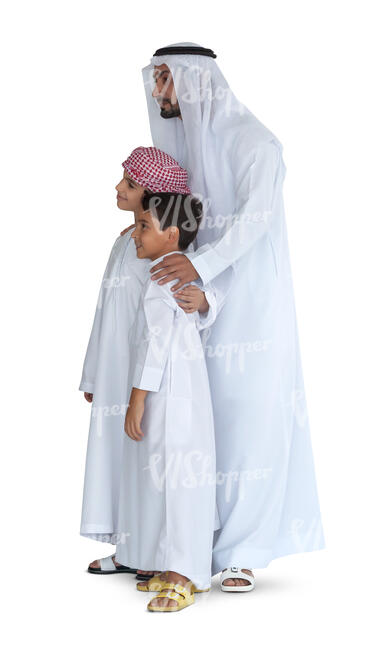 arab man with his two sons in traditional clothing standing and looking
