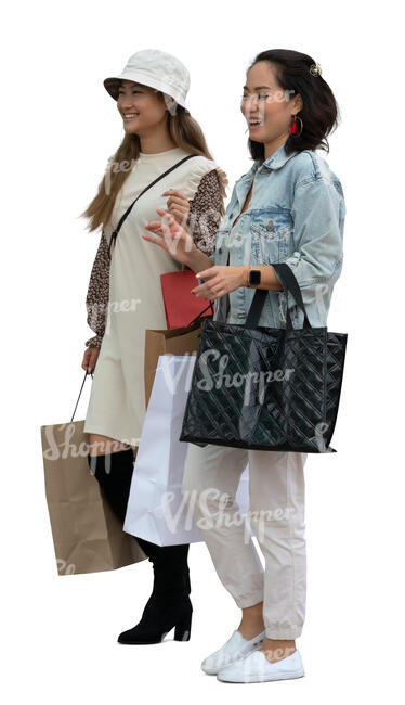 two asian women standing in front of a shop window and talking