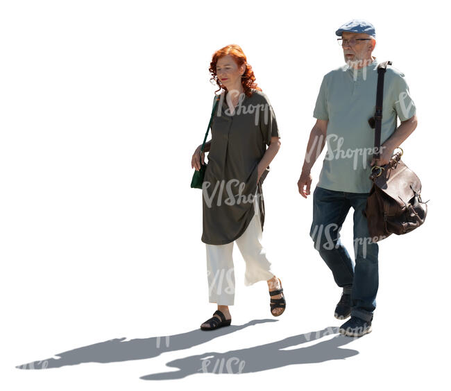 backlit elderly couple walking in summer