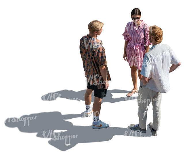 backlit top view of three people standing