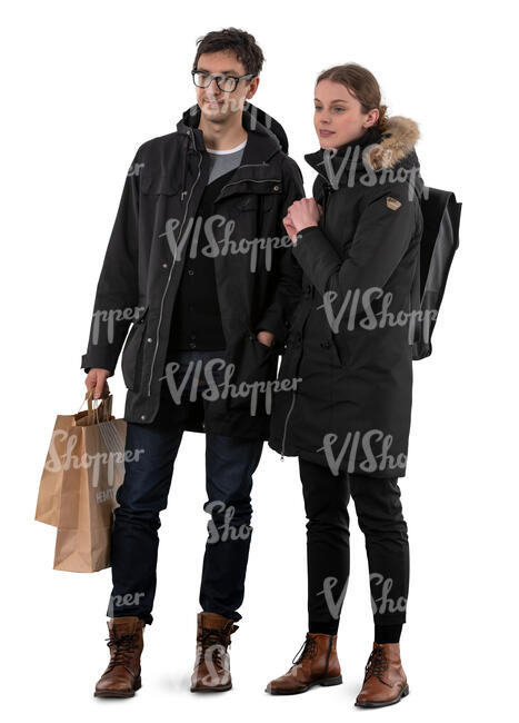 man and woman standing in winter and looking at shop windows