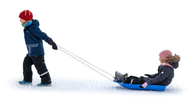 little boy pulling a sledge with a little girl sitting on it