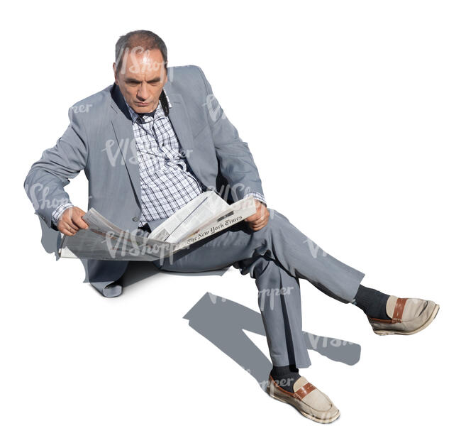 cut out older gentleman sitting and reading a newspaper seen from above