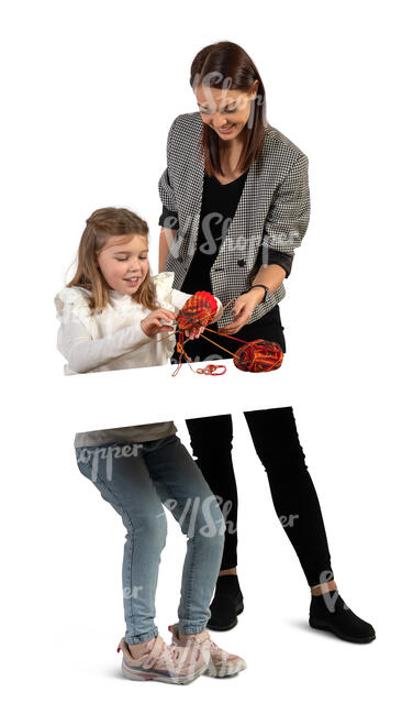 cut out little girl knitting with the help of a teacher
