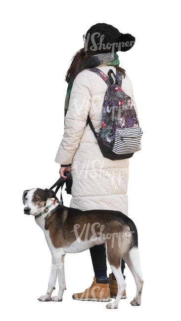 woman in winter with a dog standing and looking up