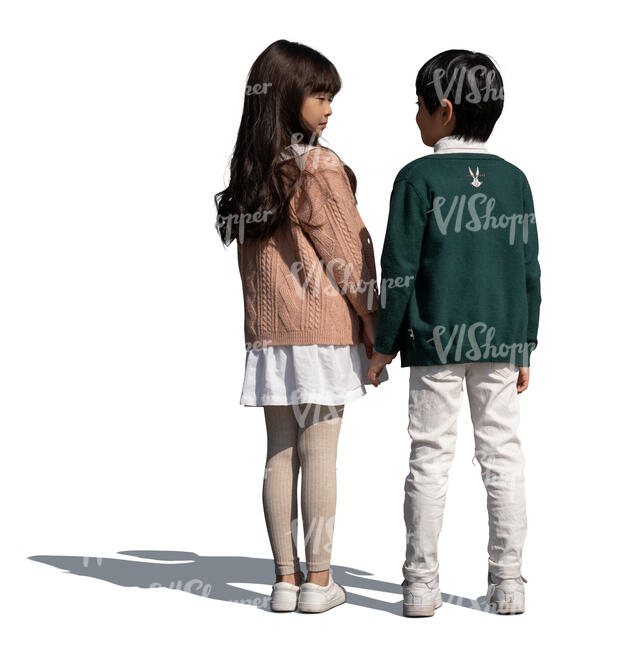two asian kids standing hand in hand