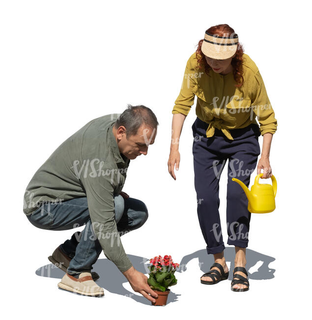 cut out man and woman planting flowers in he garden