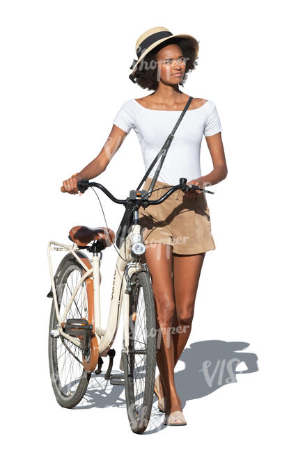 woman with a hat and a bicycle walking