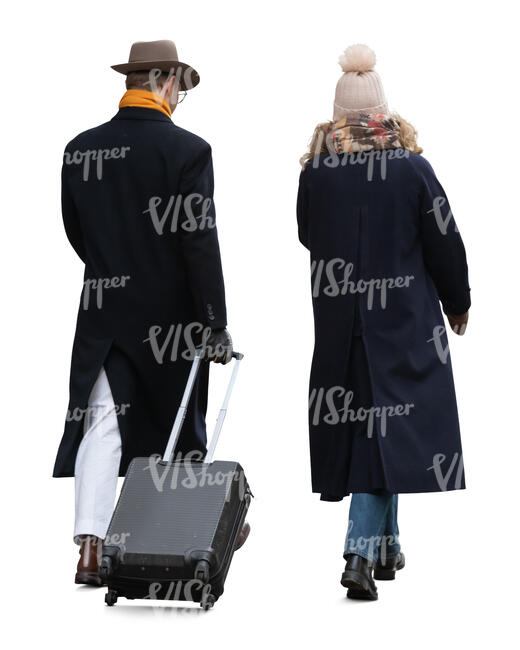 two people walking with a suitcase in winter