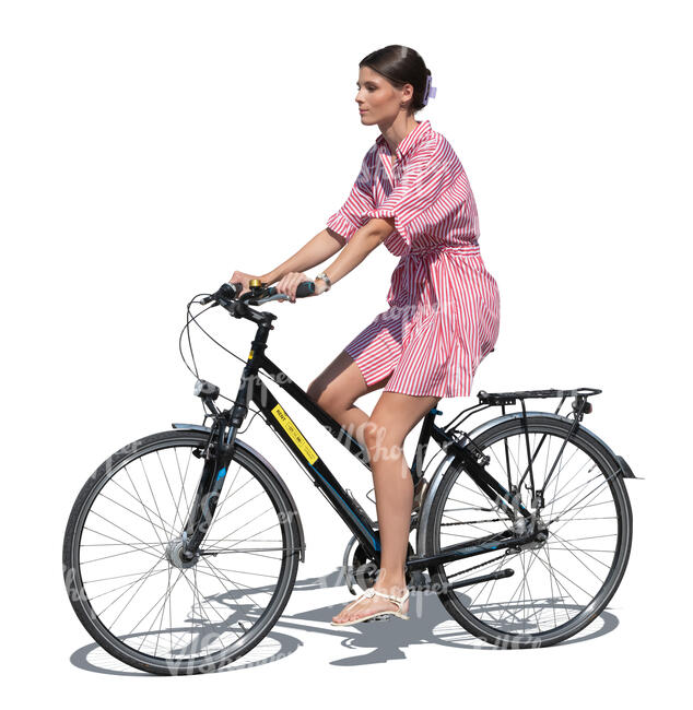 woman in a striped summer dress riding a bike