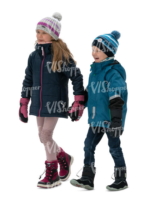 two kids walking happily hand in hand in winter