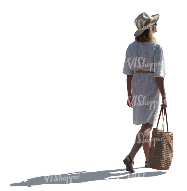 backlit woman in white summer dress walking