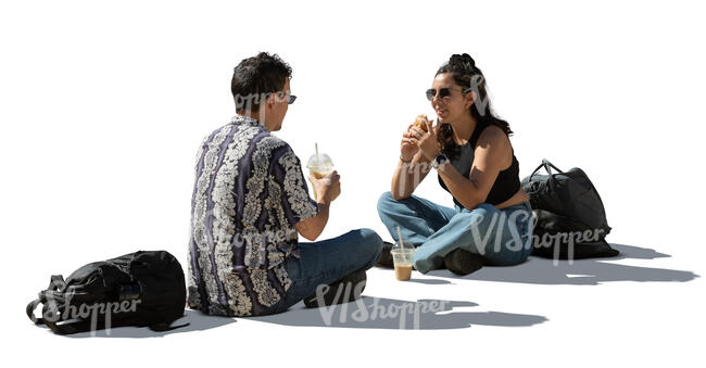 backlit sitting couple eating lunch on the street