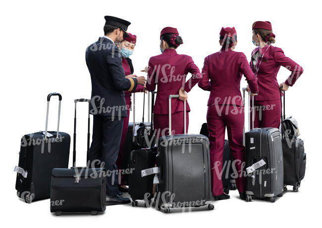 flight crew with a pilot and flight attendants with suitcases standing