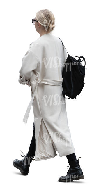 woman in a long white cardigan walking