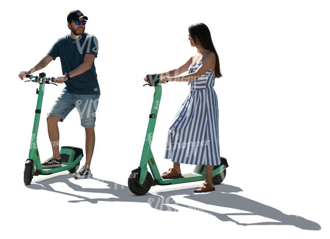 two backlit people with electric scooters standing