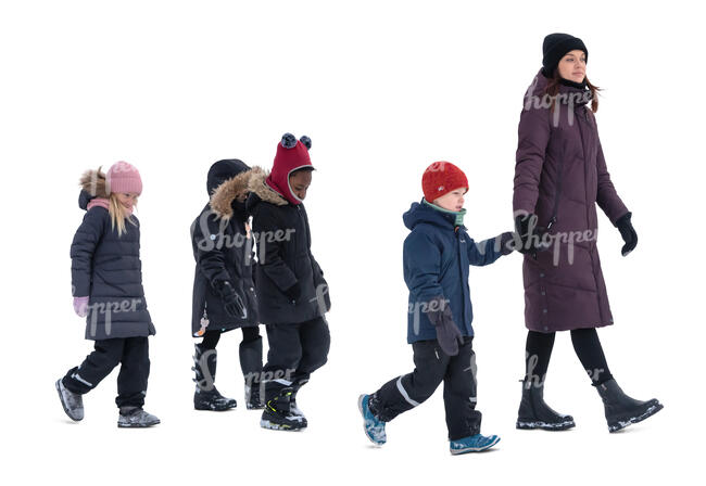 group of young school children and a teacher walking 