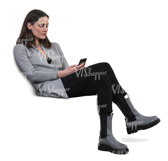 cut out woman sitting on a sofa and texting