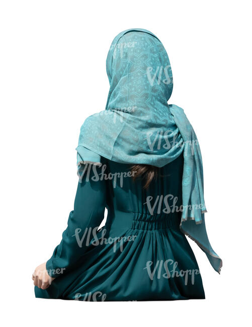 muslim woman sitting seen from back angle