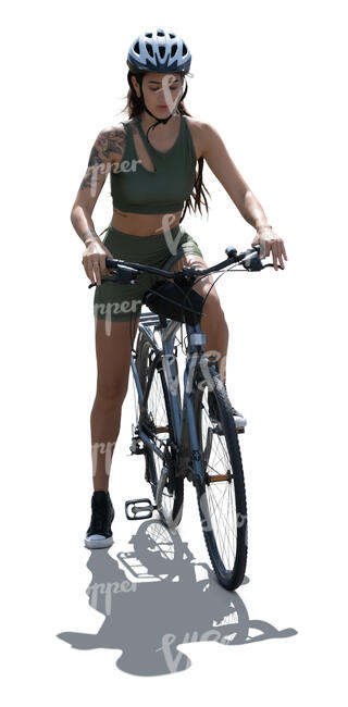 backlit woman stopping while riding a bike