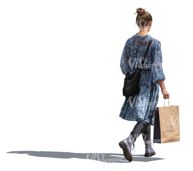 woman in a blue dress walking