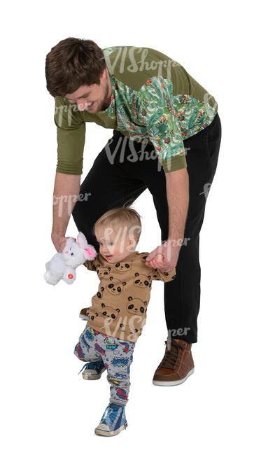 man helping his little son walk down the stairs