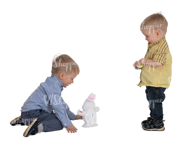 two boys playing with a toy rabbit