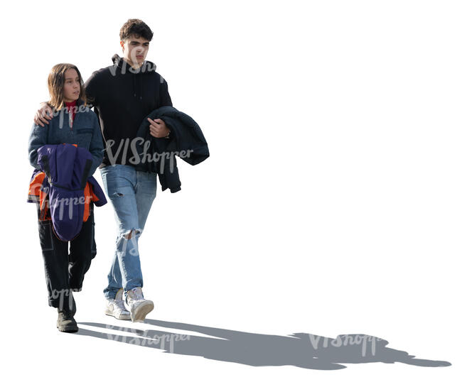 backlit couple walking together