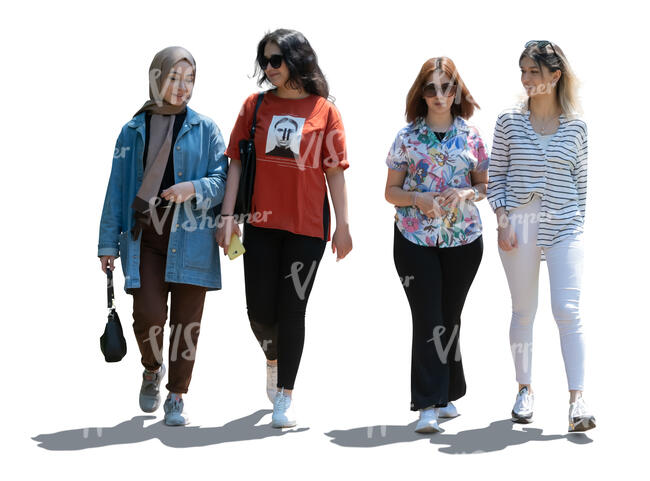 backlit group of four girls walking