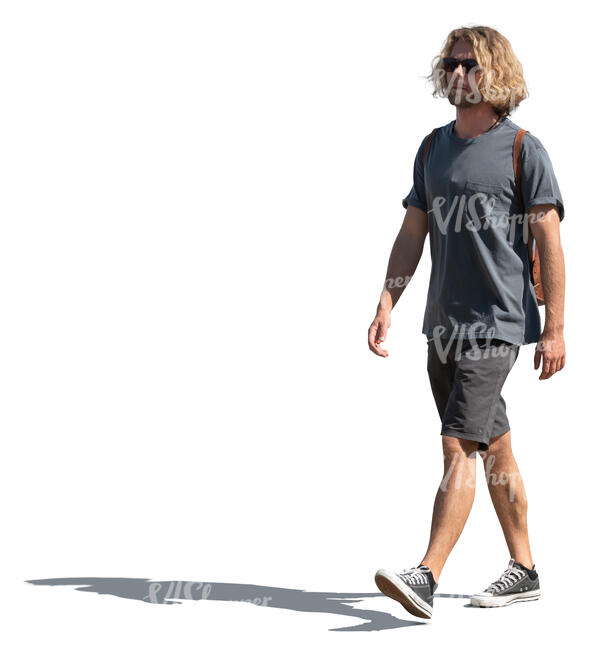 young man in shorts walking