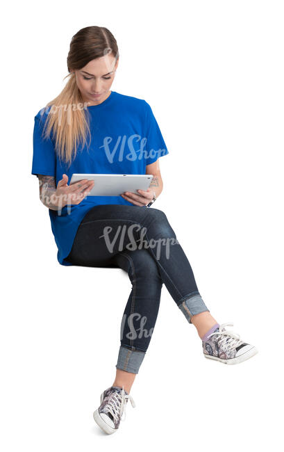 woman sitting and reading a tablet