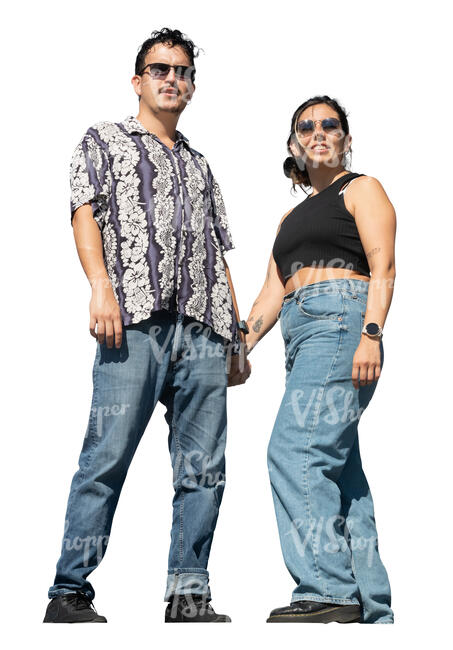 man and woman holding hands and standing up on a balcony