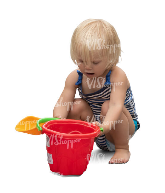 little girl playing on the beach