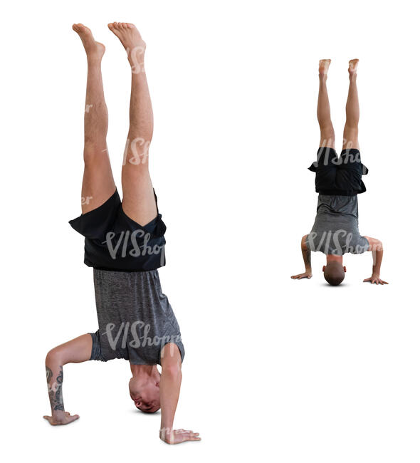 man standing on his head with a mirror reflection