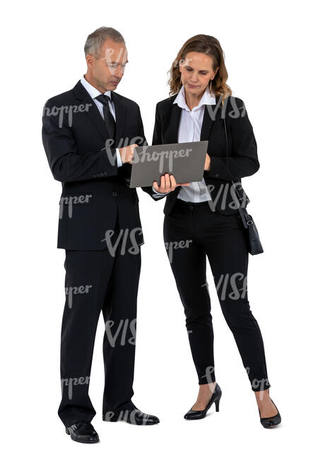 two office workers standing and looking at laptop