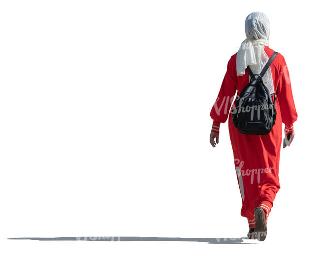sidelit muslim woman with hijab walking